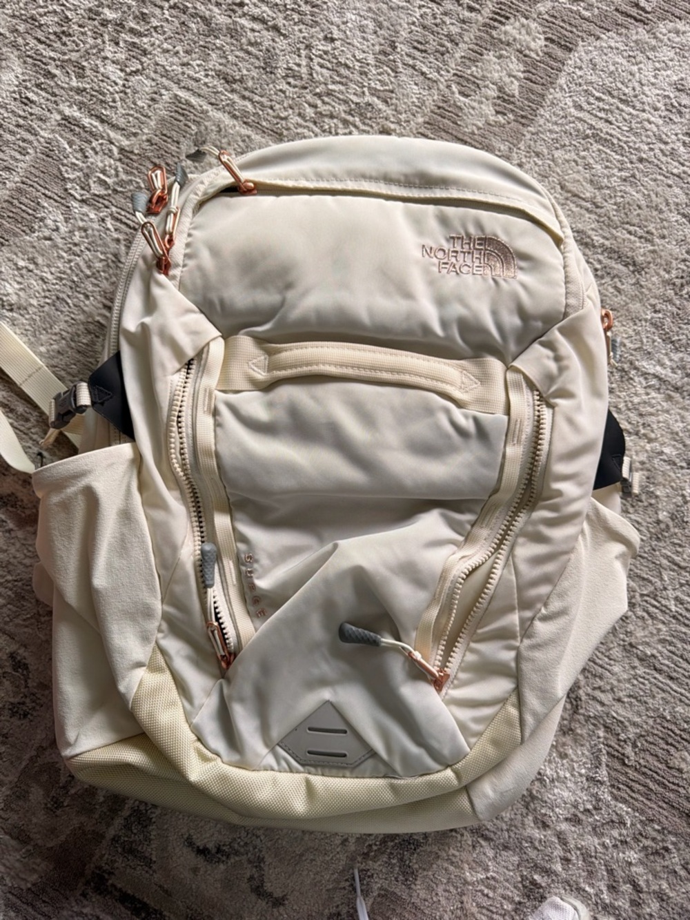 The North Face Cream Backpack with Rose Gold Accents